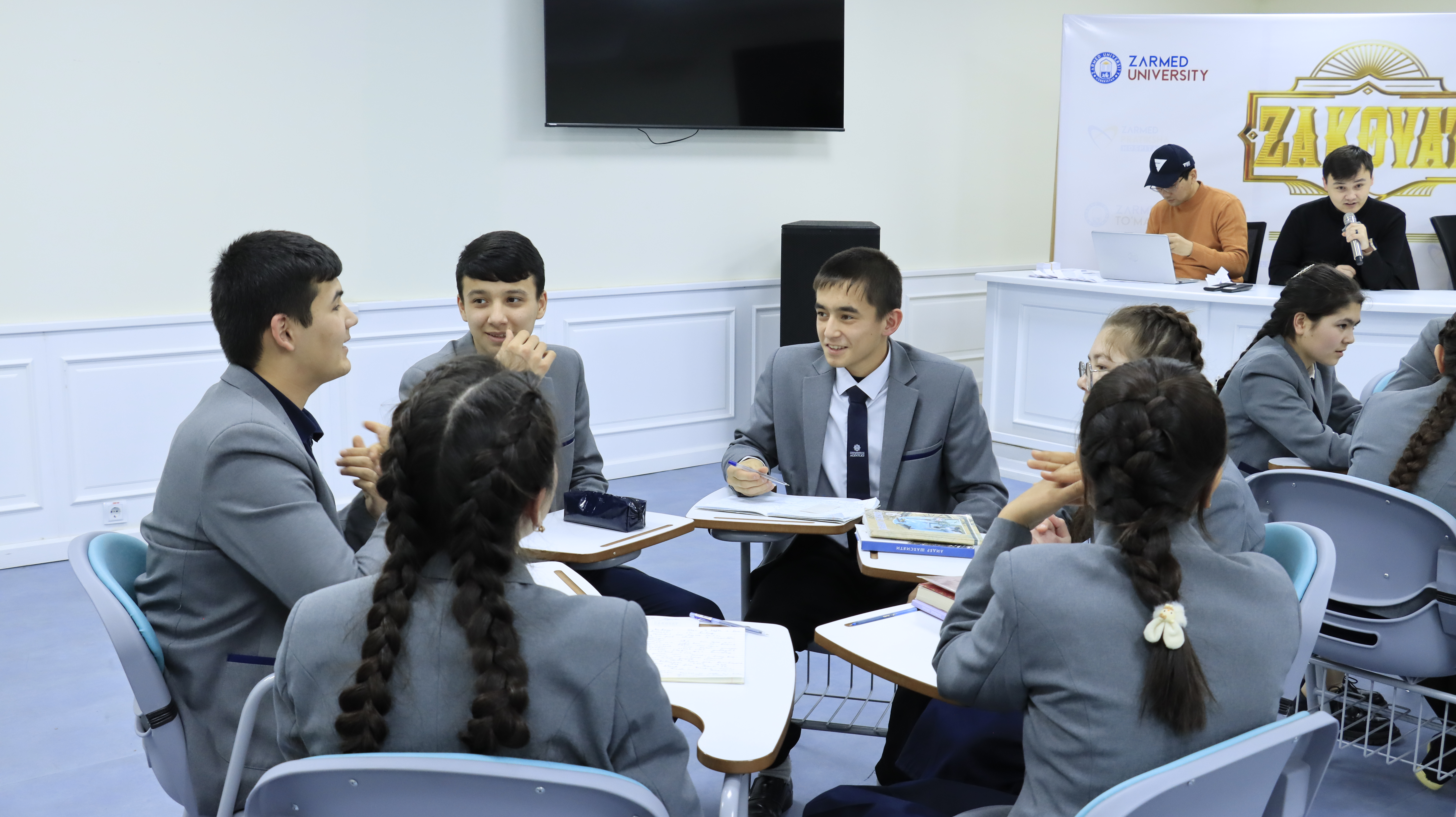 Professor working with students in a laboratory